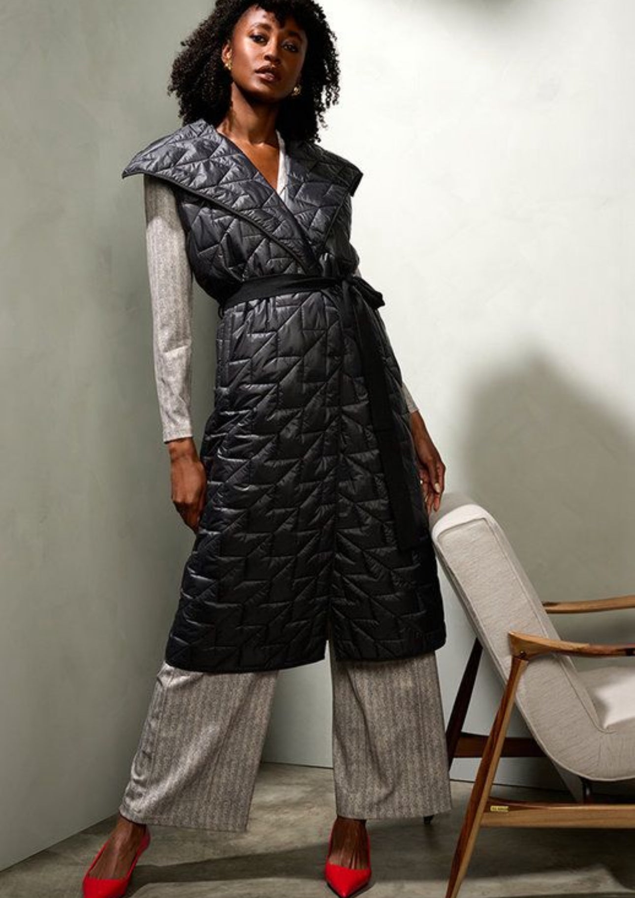 K design black quilted tie sleeveless coat