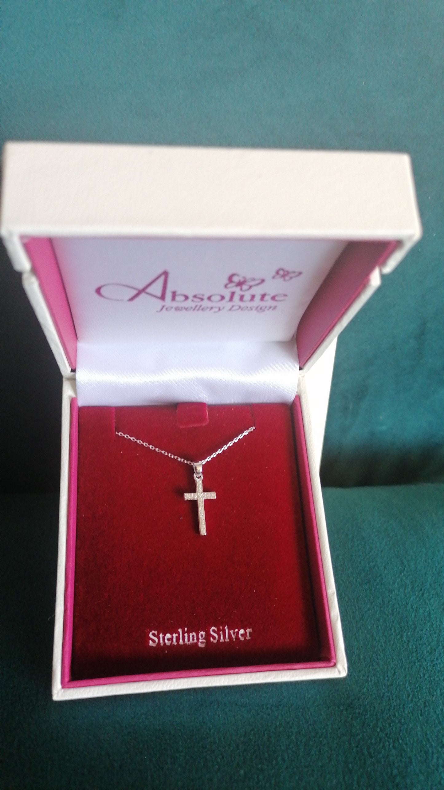 delicate chain and cross