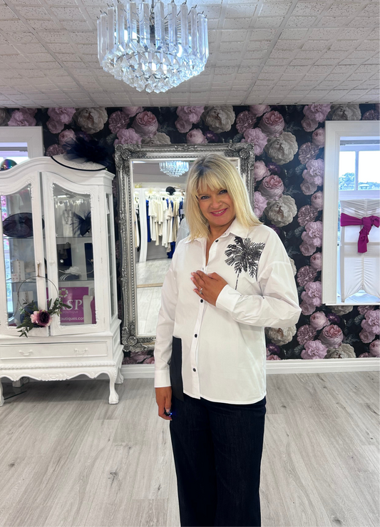 Inco white shirt with black motif. ￼