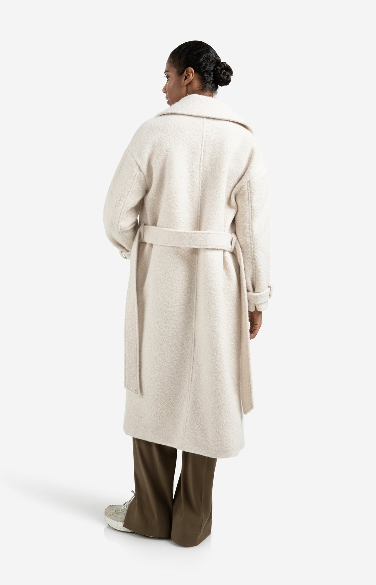 Long bouclé coat with belt and oversized fit