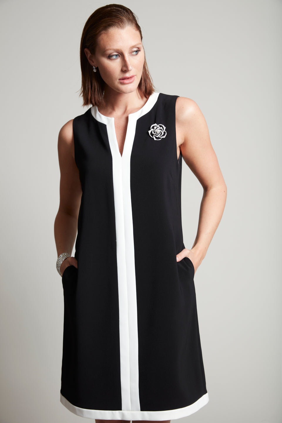 Compli K Noir sleeveless sheath dress with camelia brooch detail