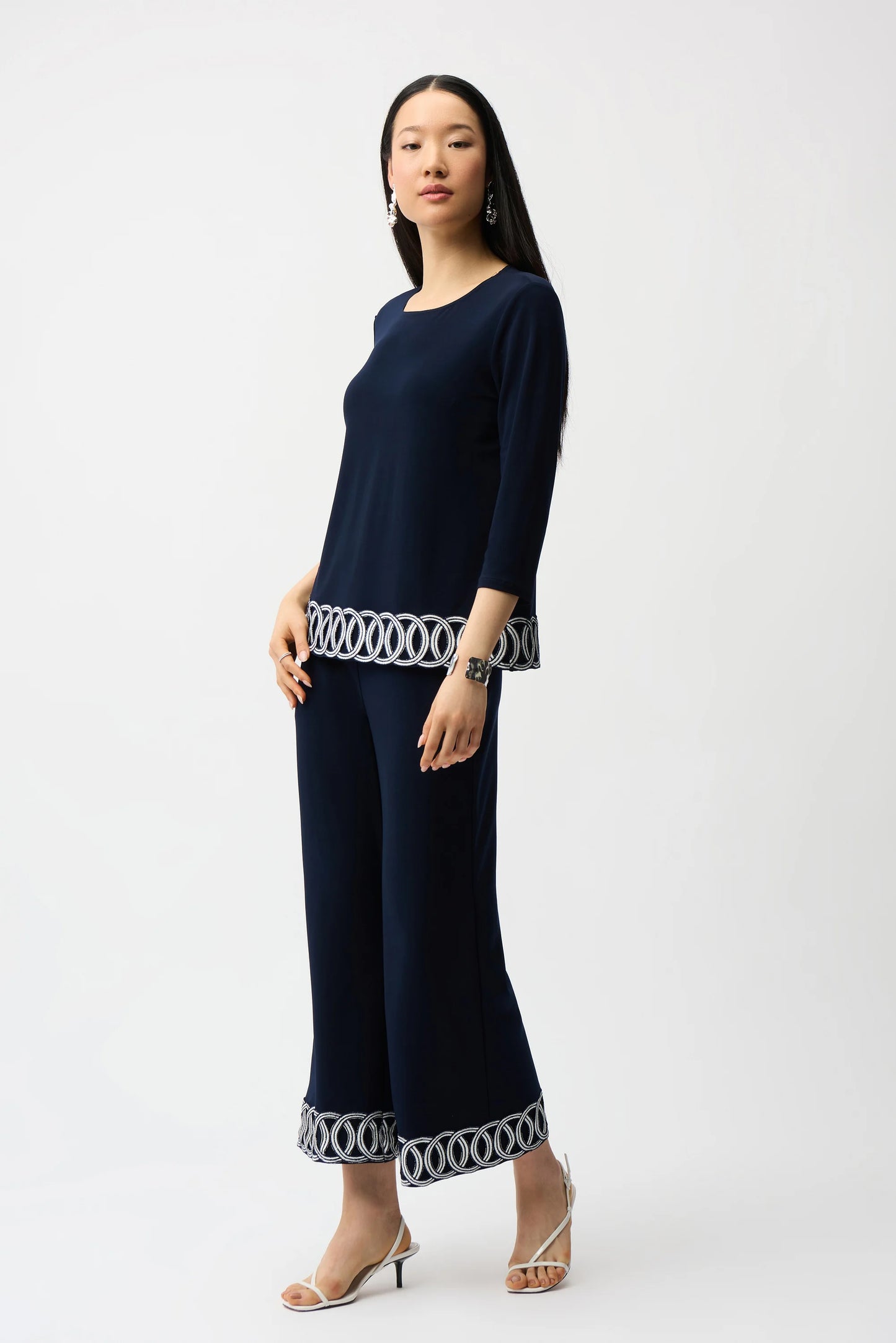 Silky Knit Fitted Top With Guipure Hem Detail
261069