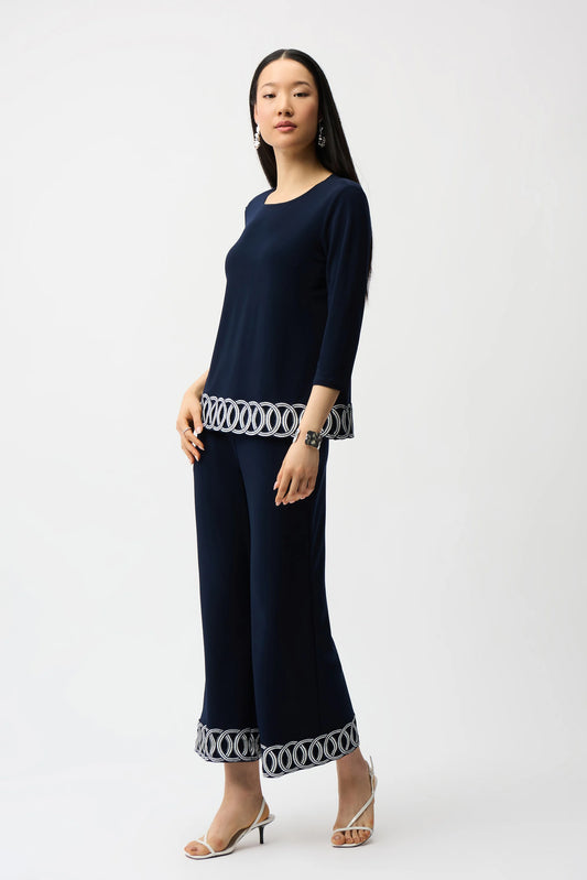 Silky Knit Fitted Top With Guipure Hem Detail
261069