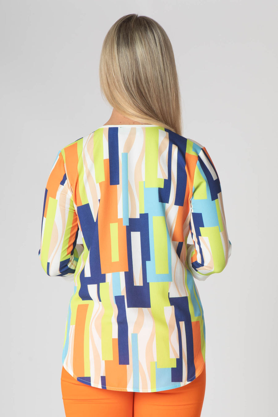 Paige v neck top with white trim- orange and green.