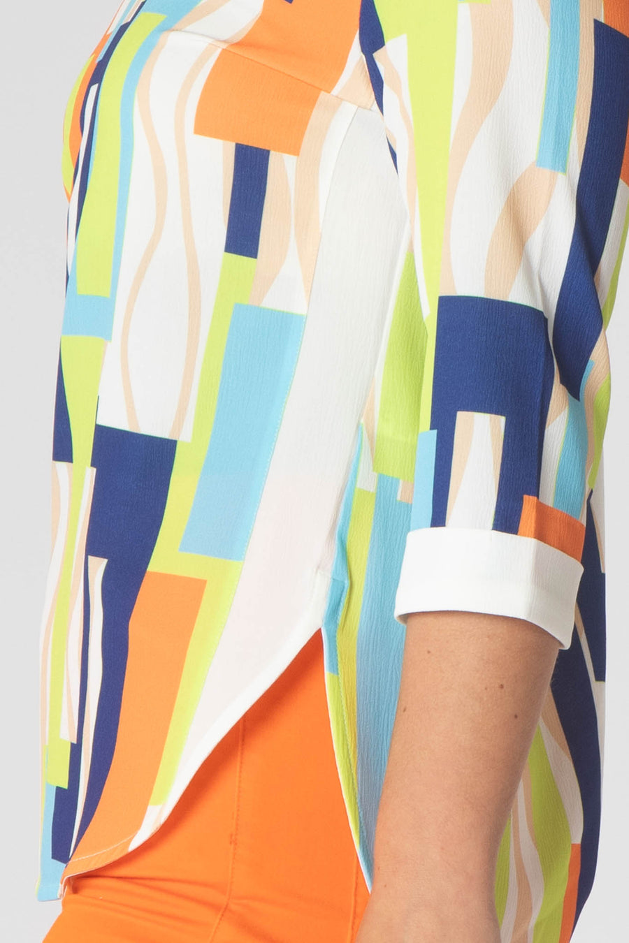 Paige v neck top with white trim- orange and green.