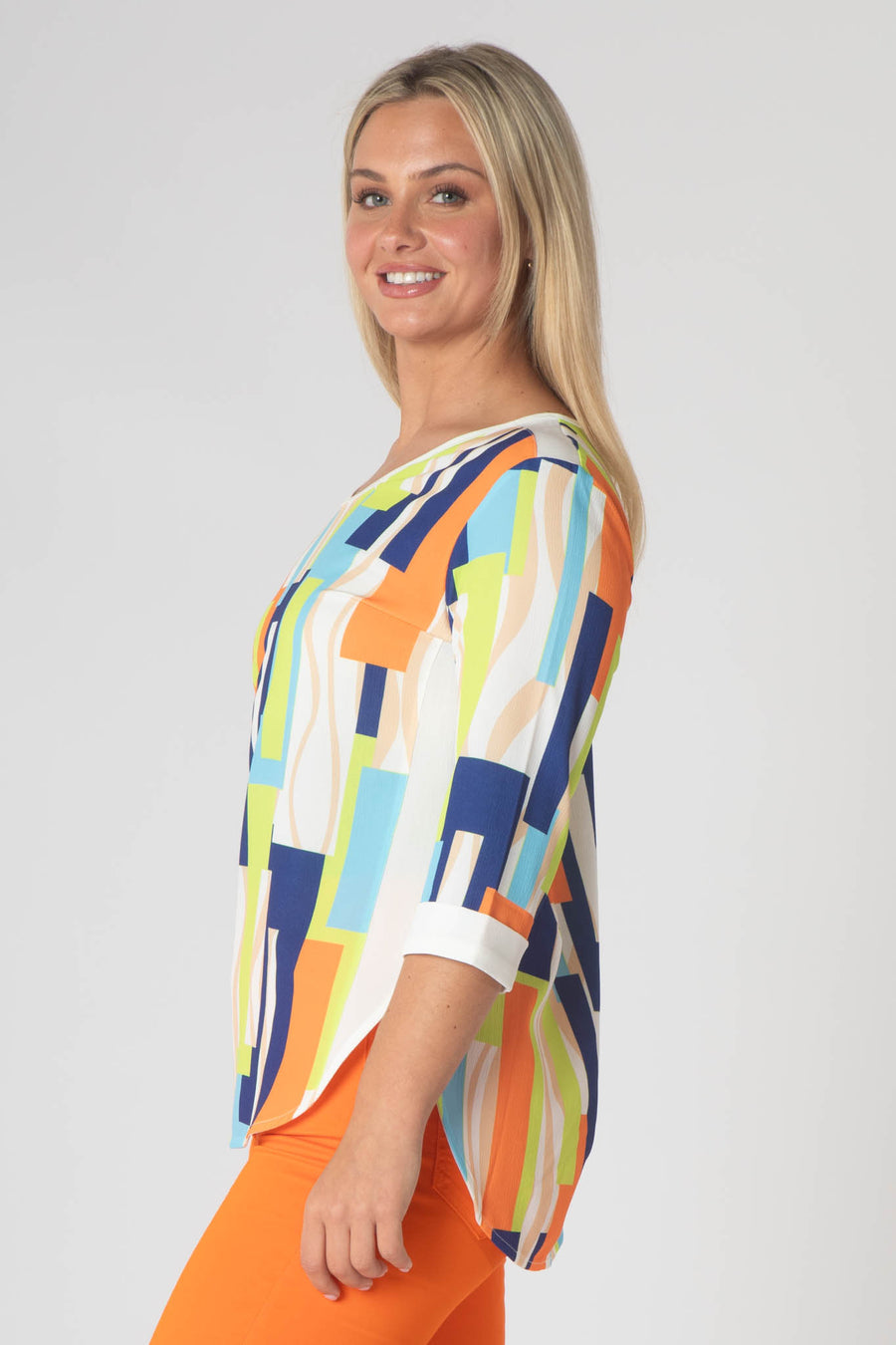 Paige v neck top with white trim- orange and green.