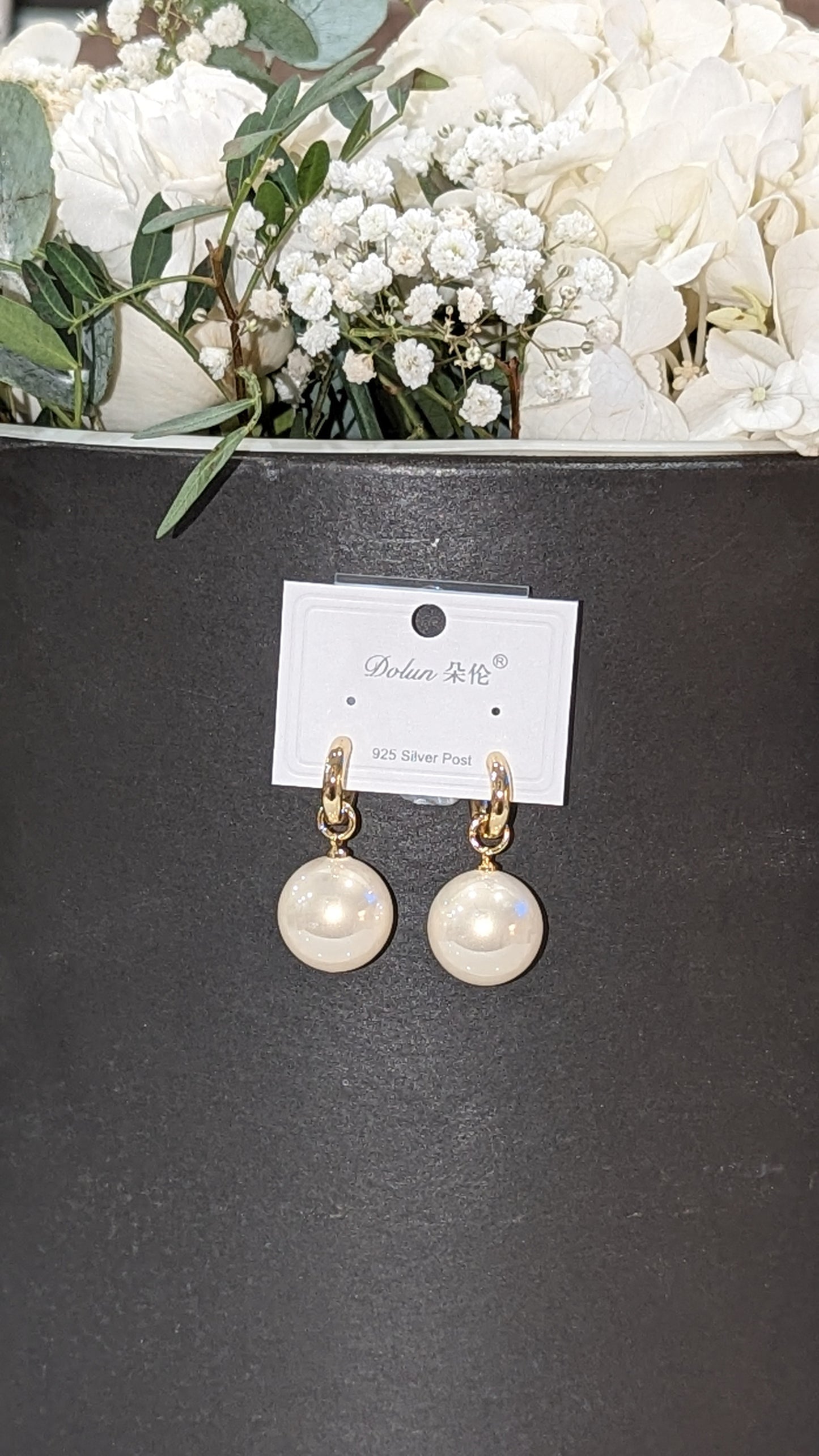 Large pearl earrings