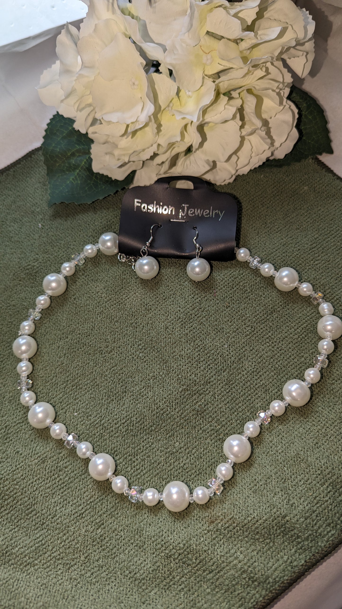 White pearl necklace and earrings