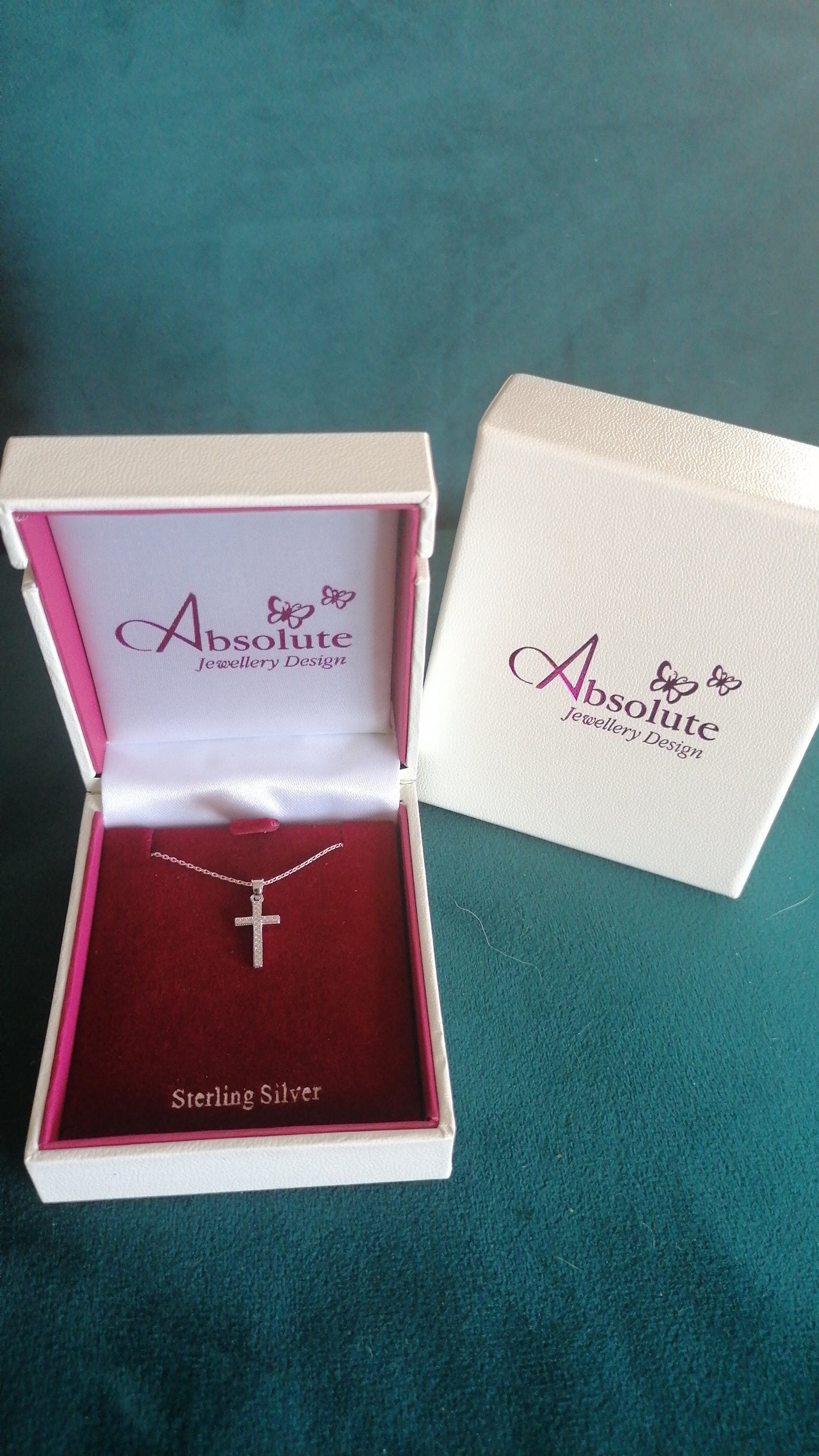 delicate chain and cross